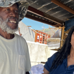 Staff delivering fisheries relief packages Jamaica fishers received at Belmont Fishing Beach.