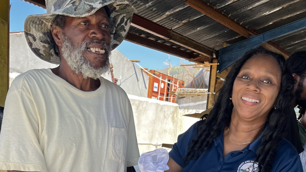 Staff delivering fisheries relief packages Jamaica fishers received at Belmont Fishing Beach.