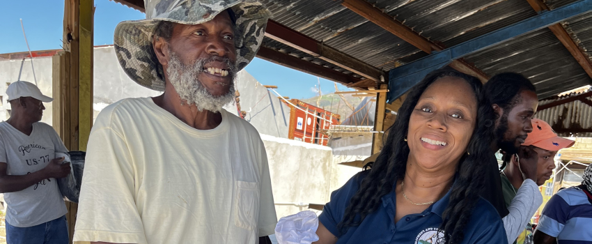 Staff delivering fisheries relief packages Jamaica fishers received at Belmont Fishing Beach.